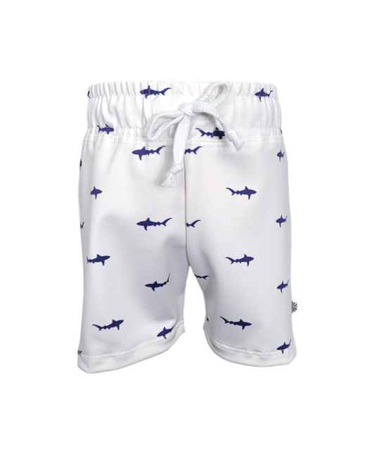 Front of sustainable Boys white swim shorts with small blue sharks