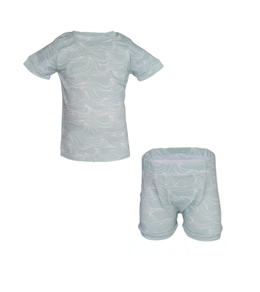 Front of Celestial Waves Summer Pajama Set. Organic green short sleeve and short set with white lined waves.