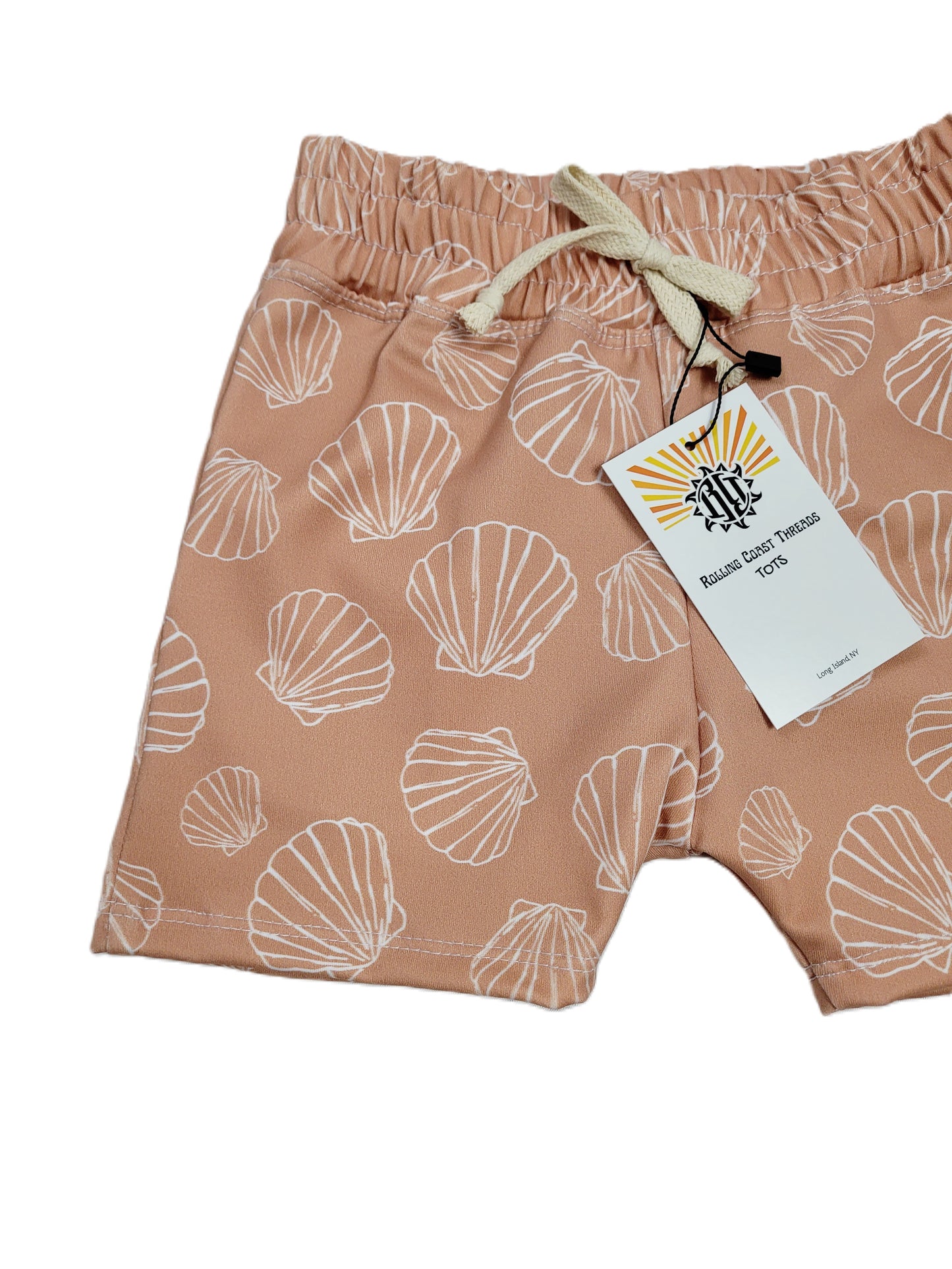  Close up of Boys Copper Swim Shorts with white outlined scallops