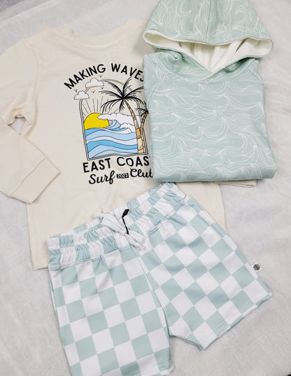 Boys white and mint green checkered swim shorts paired with shirt and hoodie