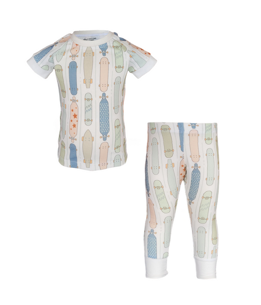 Front of Skater Pajama Set. Organic white short sleeve and pant set with pastel colored skateboards.