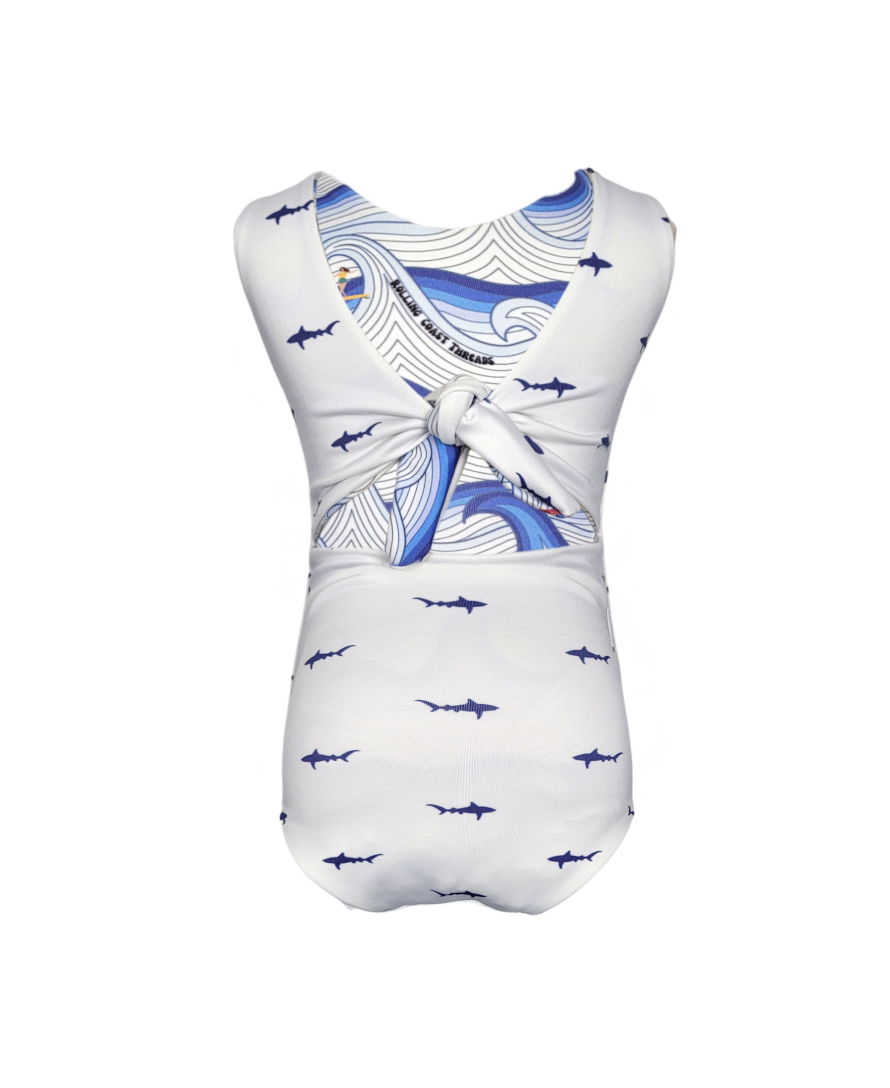 Girls Reversible Swimsuit. White with small blue sharks.