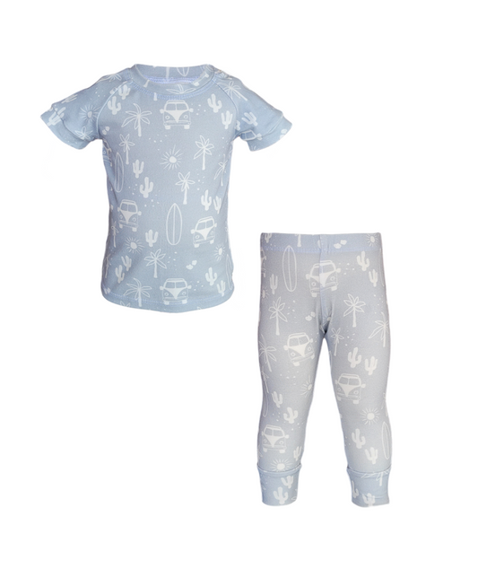 Front of VW Van Pajama Set. Organic light blue short sleeve and pant set with white surfboards, vans and cacti