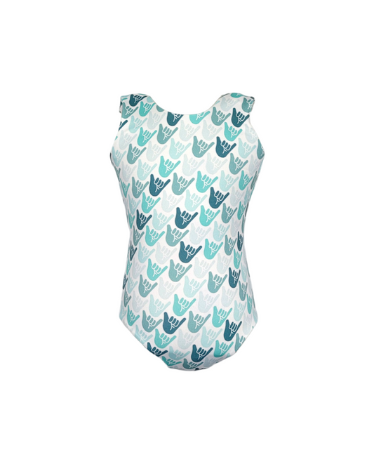 Girls reversible swimsuit. White with green and teal shaka hands.
