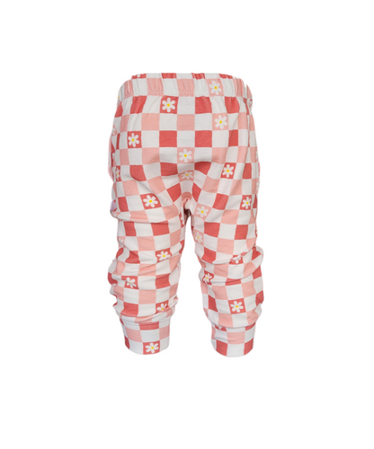 Back view of girls organic cotton sweatpants in pink checkered daisy print with elastic waistband and cuffed ankles
