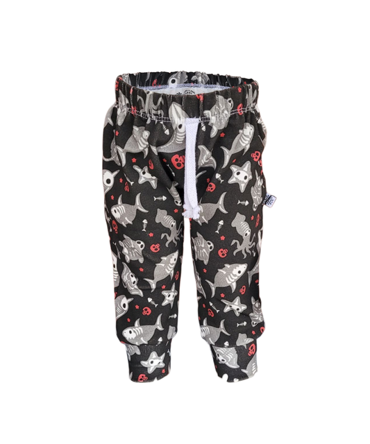 Kids sweatpants with spooky skeleton fish and sea creatures print on black background – handmade from soft cotton with white drawstring